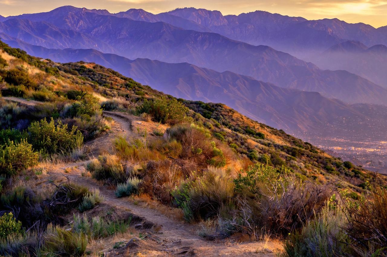 San Gabriel Mountains above Glendale at golden hour, ridgelines layered in violet haze